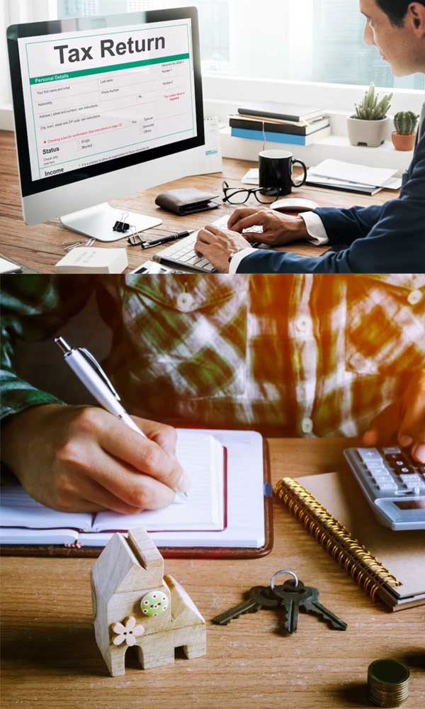 A workspace with a tax return on the monitor, a person writing notes, a house model, keys, and a calculator.